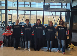  Four Women holding black t shirts
